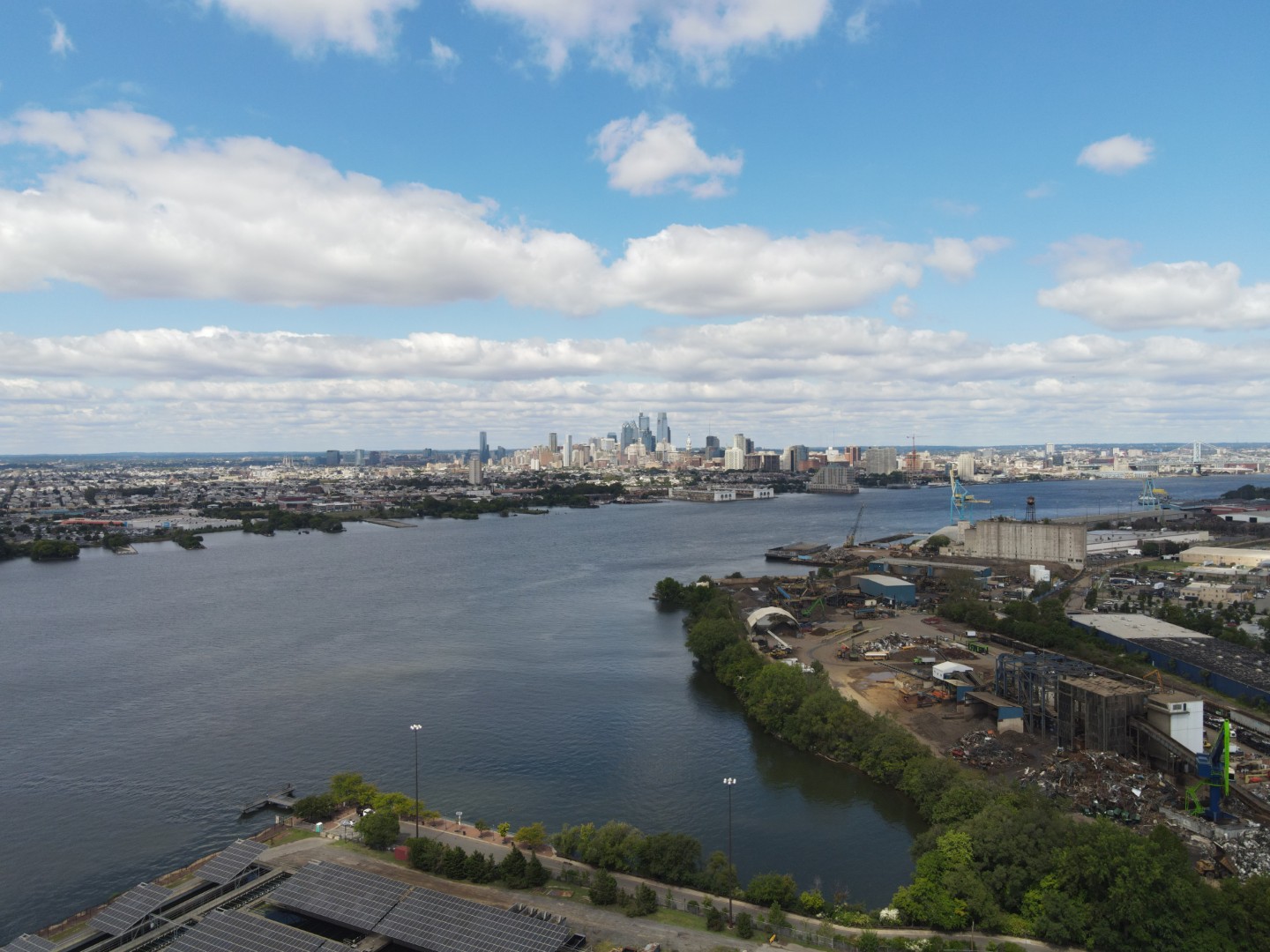 Aerial view of Camden County wastewater treatment facility along Delaware River with Philadelphia skyline